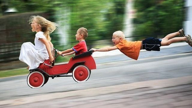 [ children down hill having fun pic ]